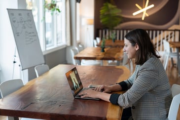 woman doing a video interview at her desk