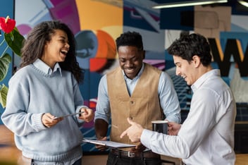 smiling coworkers chatting together