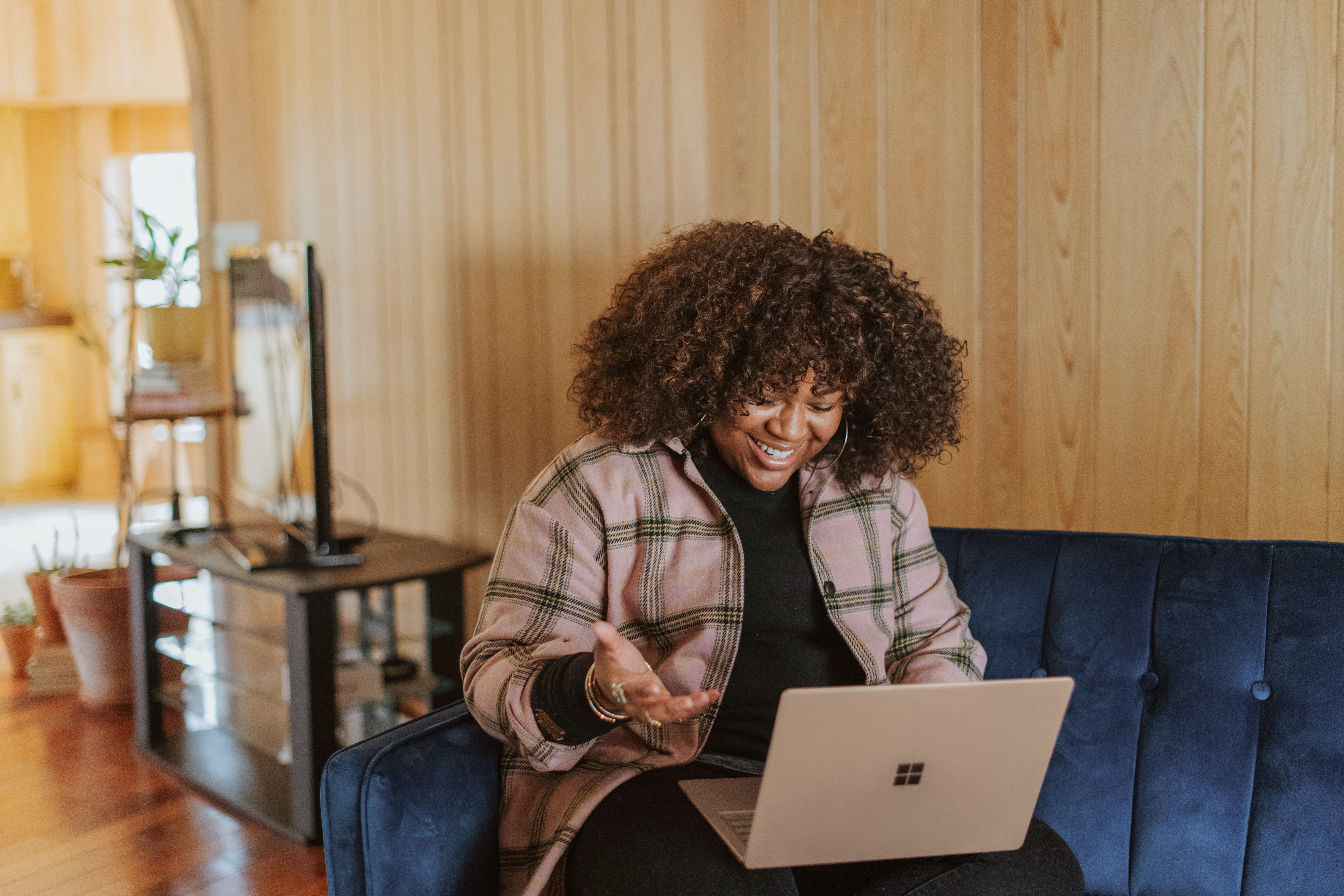 woman working from home on her laptop on a couch